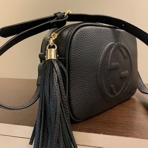 Black compact shoulder bag